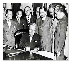 Truman signs the Luce-Celler Act of 1946